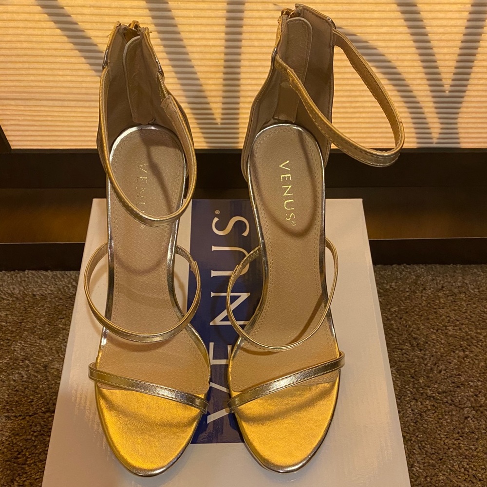 Gold heels brand new in original packaging.